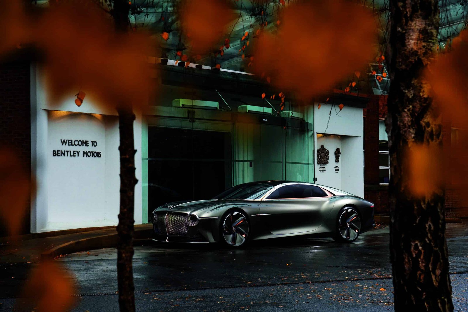 The experimental concept car is parked in front of a building.