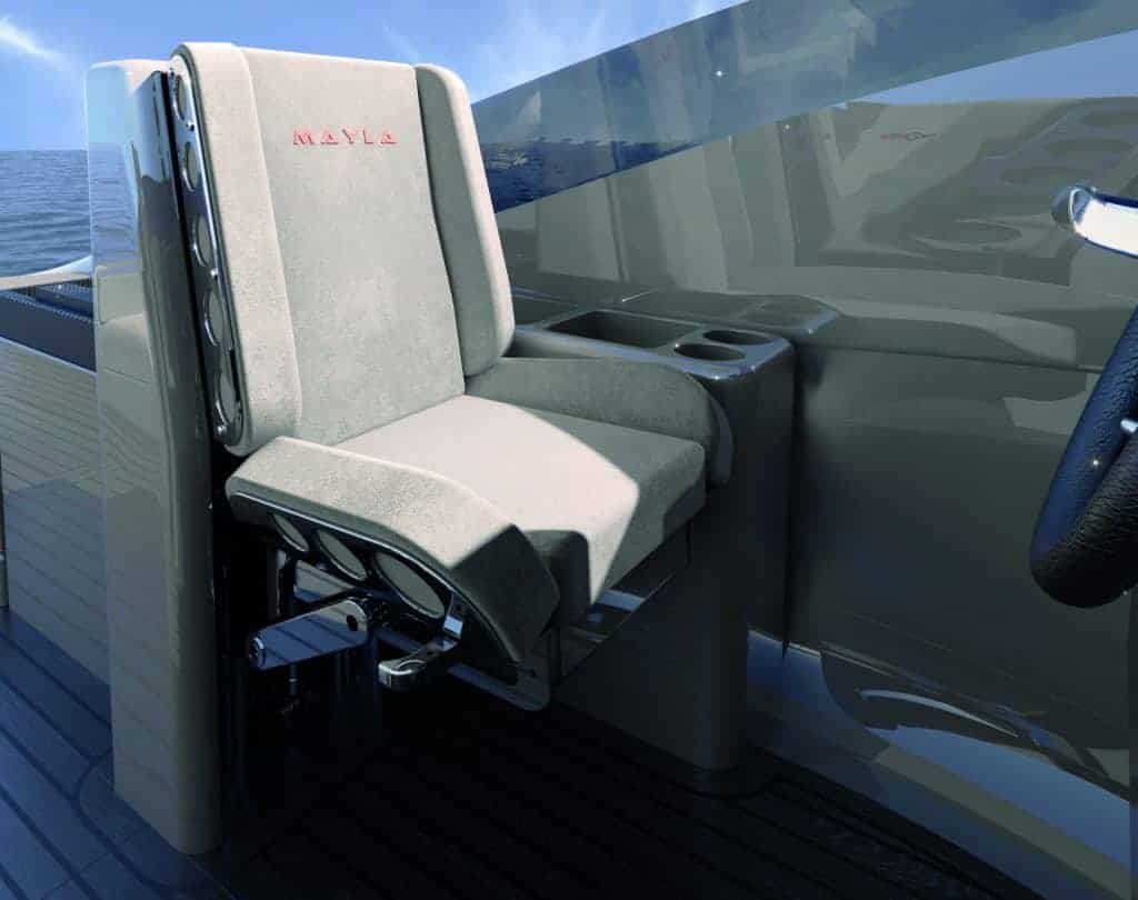 A bespoke yacht's interior featuring a carbon seat and steering wheel.