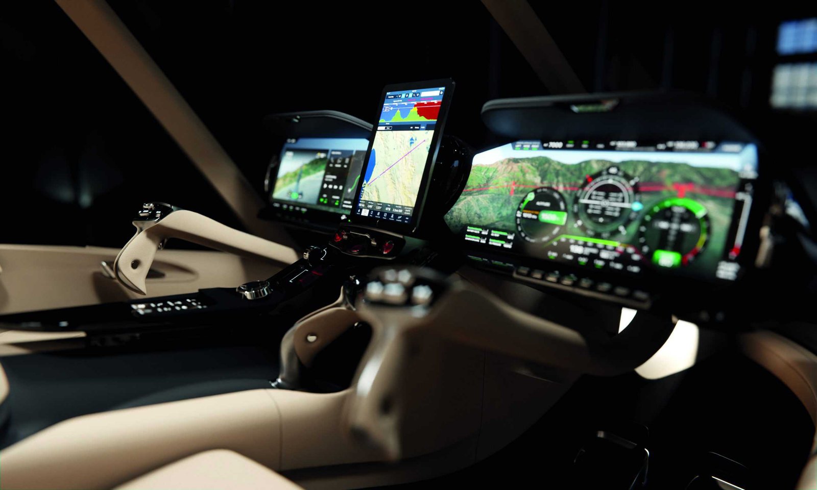 The interior of a car with two monitors and a steering wheel that evokes a sense of blue-sky thinking.
