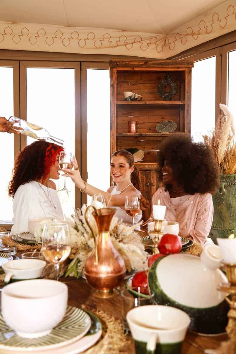 A group of women at a table, designed to create a good atmosphere.
