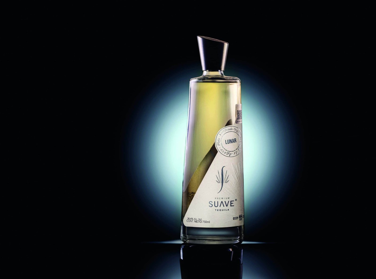 A bottle of olive oil on a promising black background.