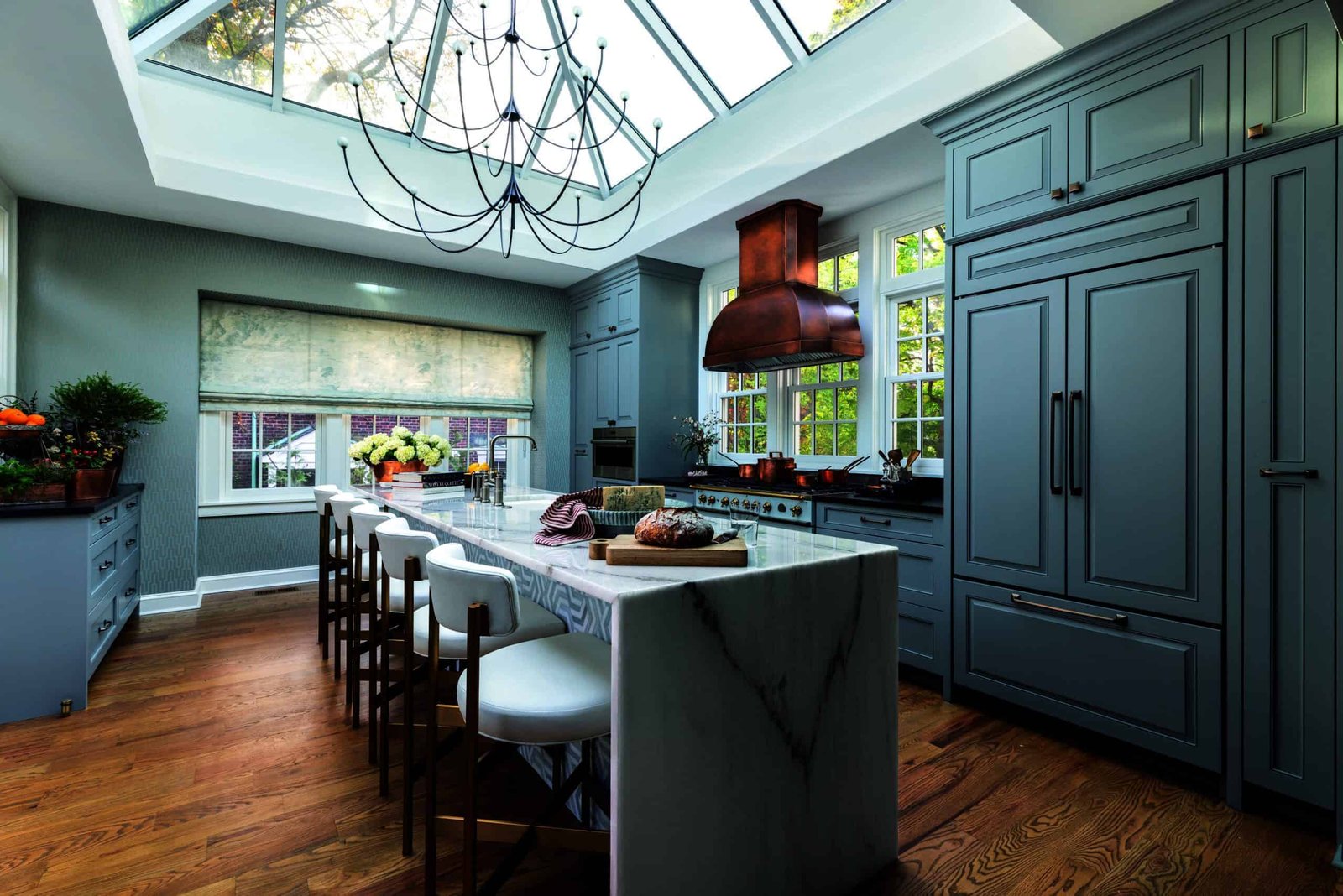 A kitchen with a skylight above the range top.