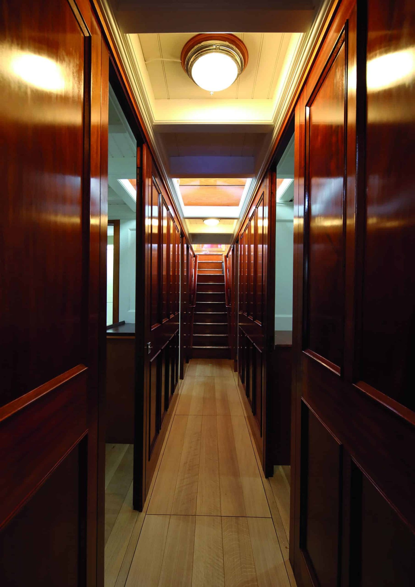 A tide-turning hallway with wooden doors.