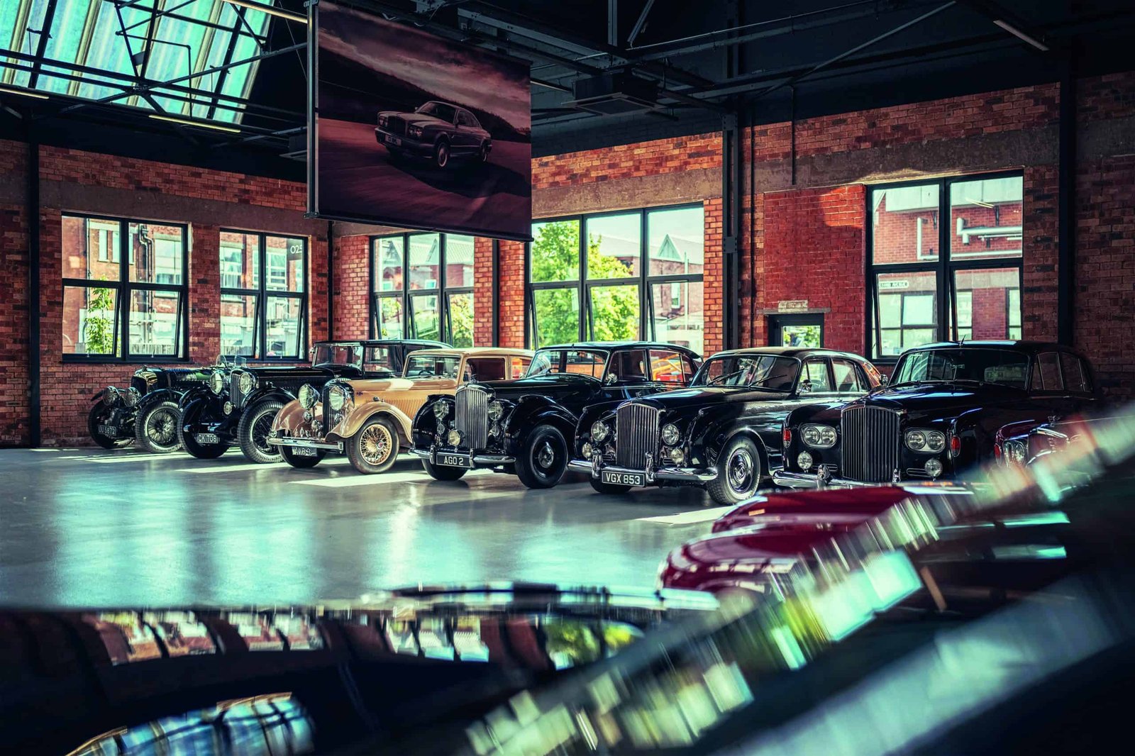 A group of cars parked in a room.