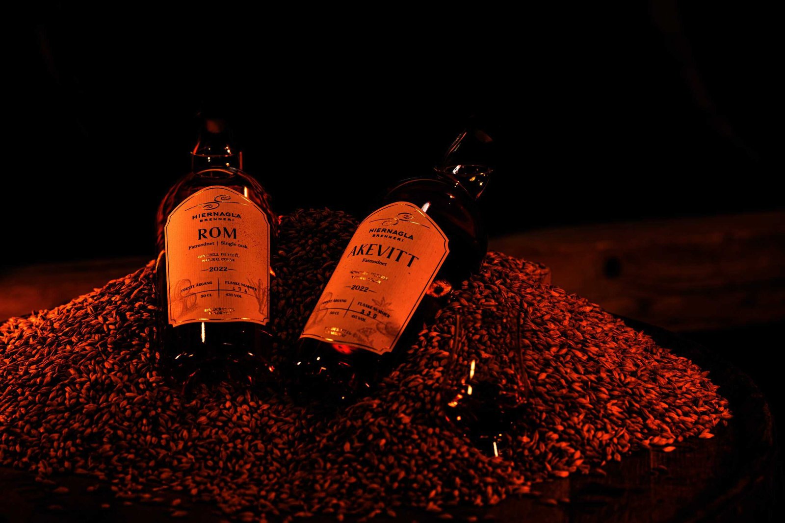 Two bottles of whisky sit on top of a barrel, signaling the beginning of an exciting venture.