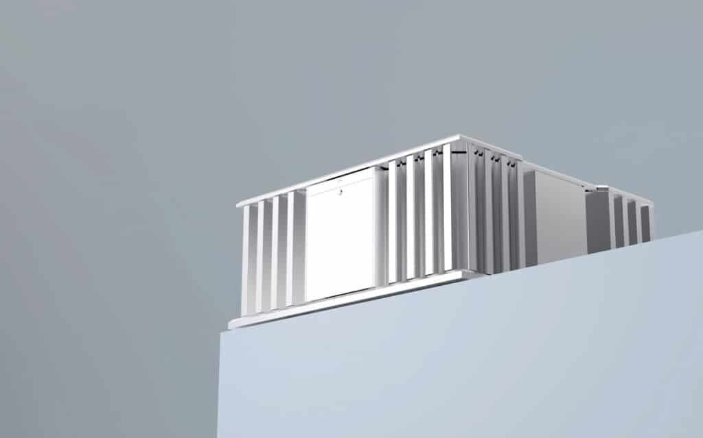 A sound barrier, resembling a white box, placed on top of a wall to minimize noise-breaking.