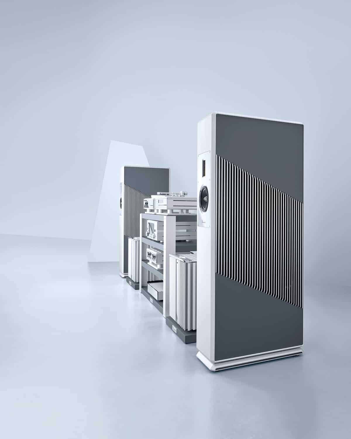 A white and gray room with a large number of sound barriers placed among the speakers, effectively breaking any unwanted noise.