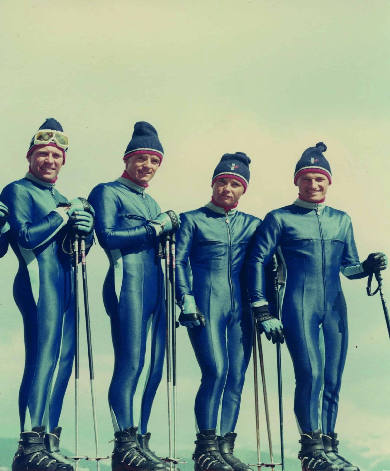 A group of freestyle skiers posing for a picture.
