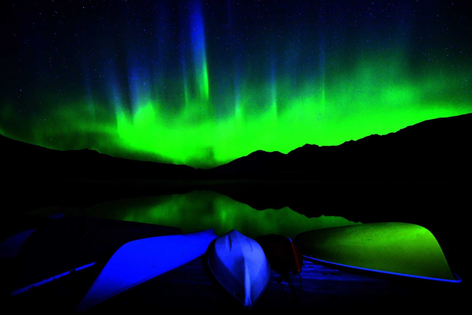 Four canoes on a dock.