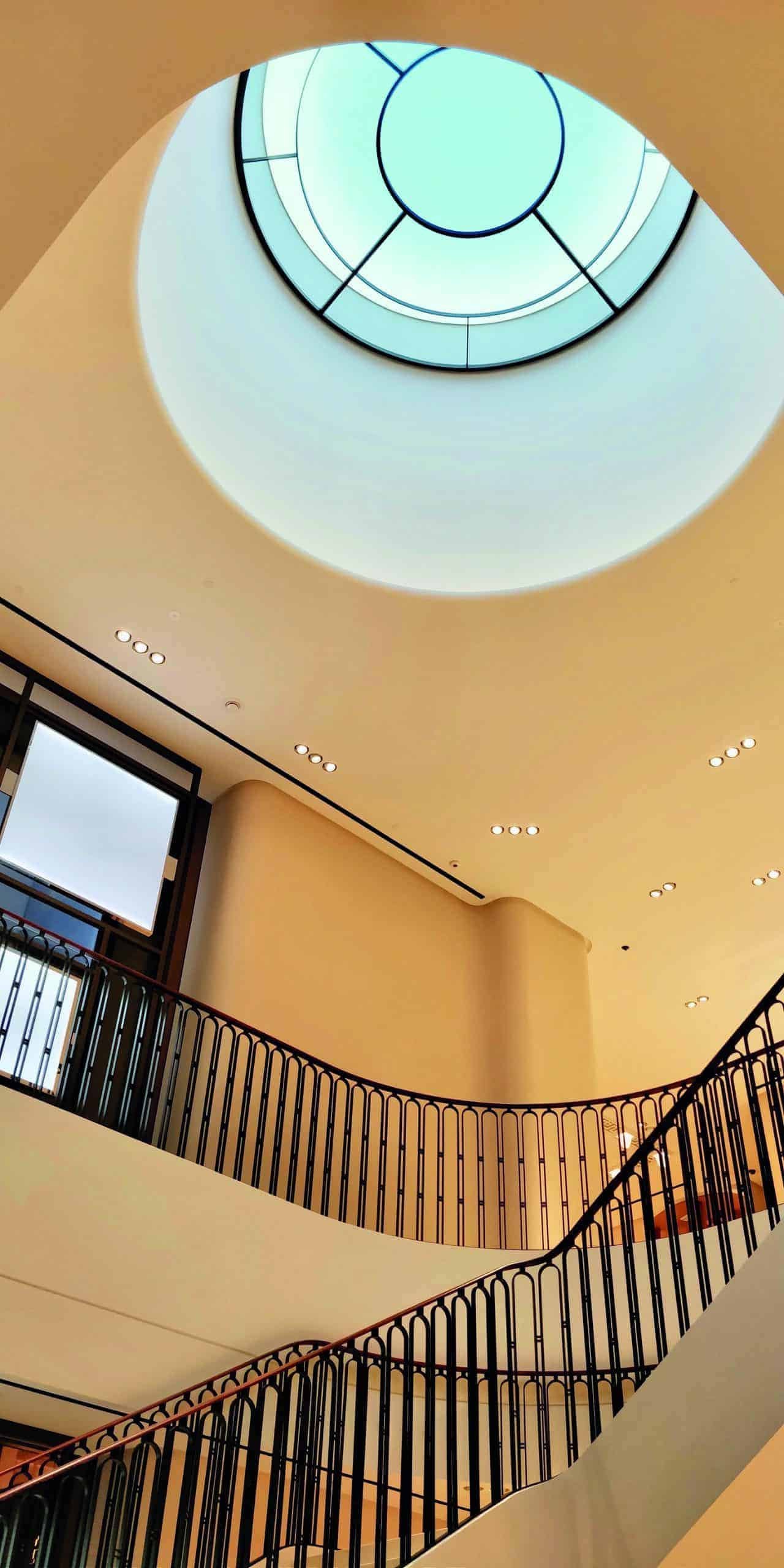 A circular ceiling in a building with the right light.