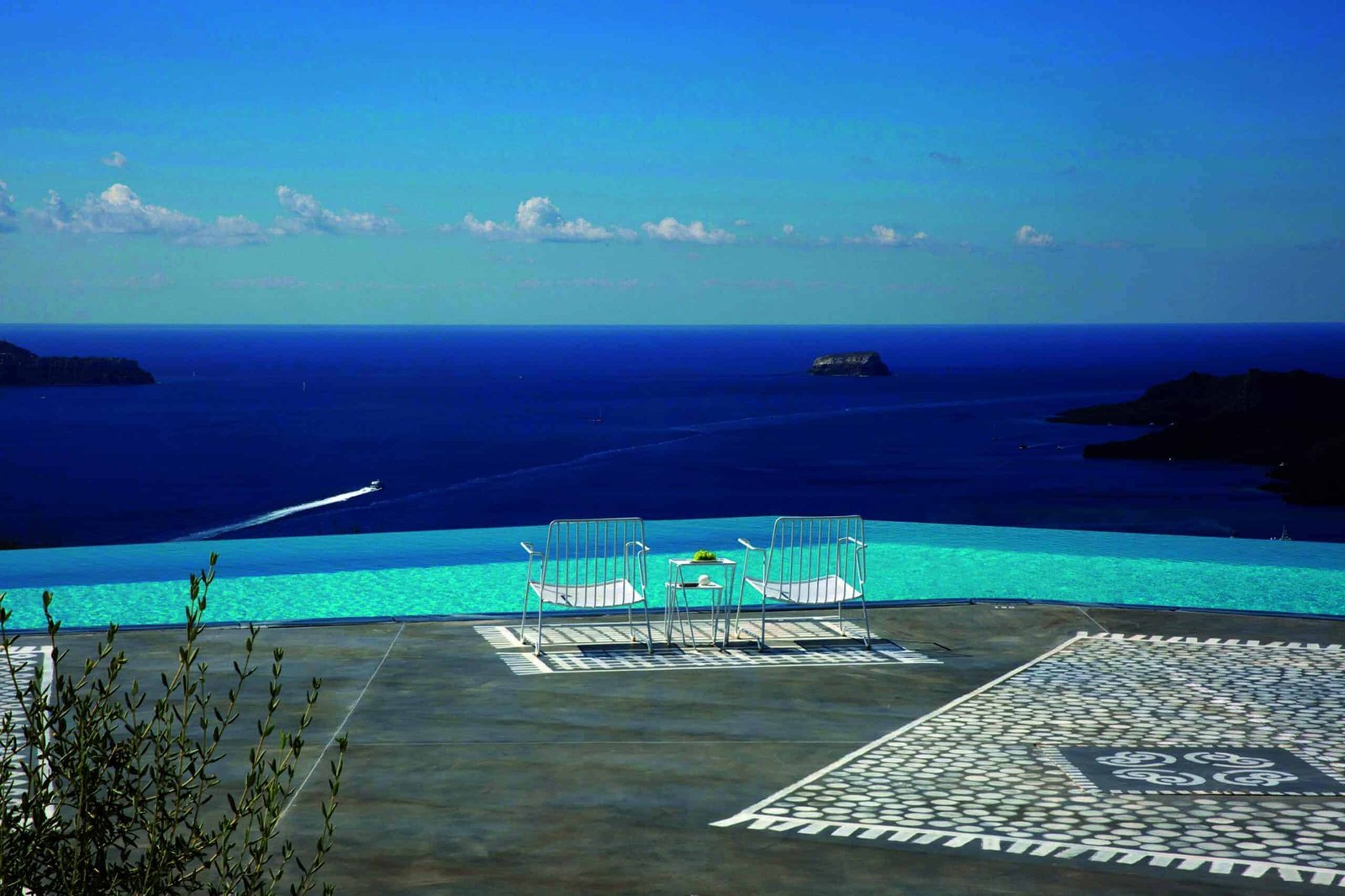 A blissful pool with a Hellenic view of the ocean.