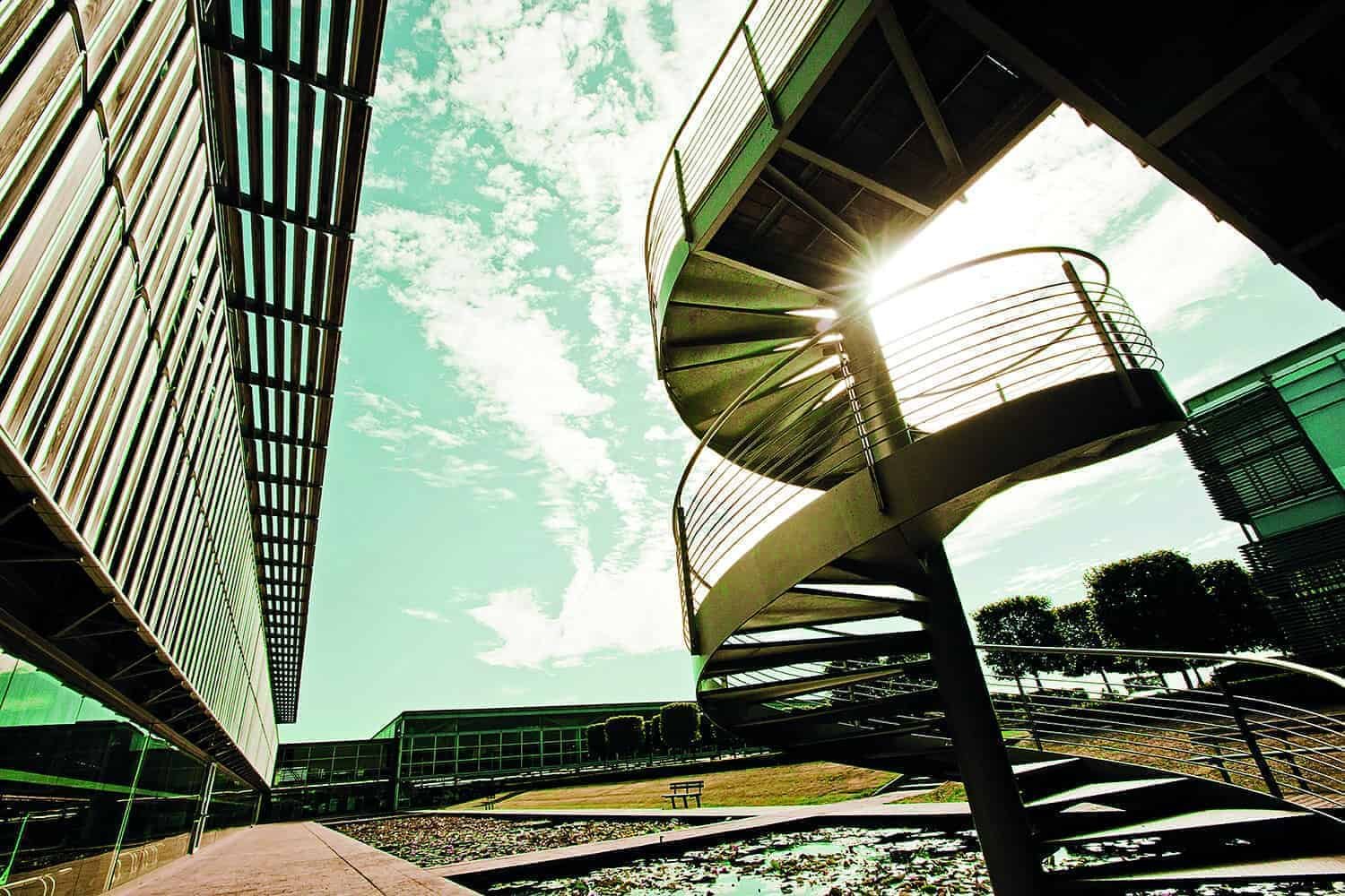 A spiral staircase in front of a building.