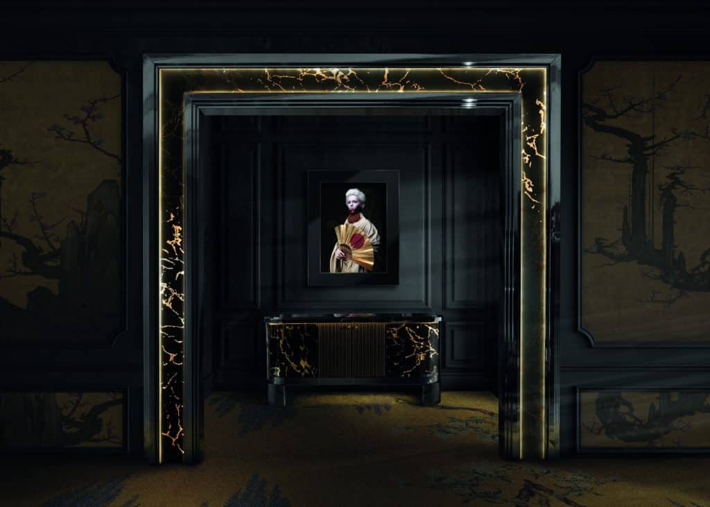 A glimmering black and gold room with a painting on the wall.