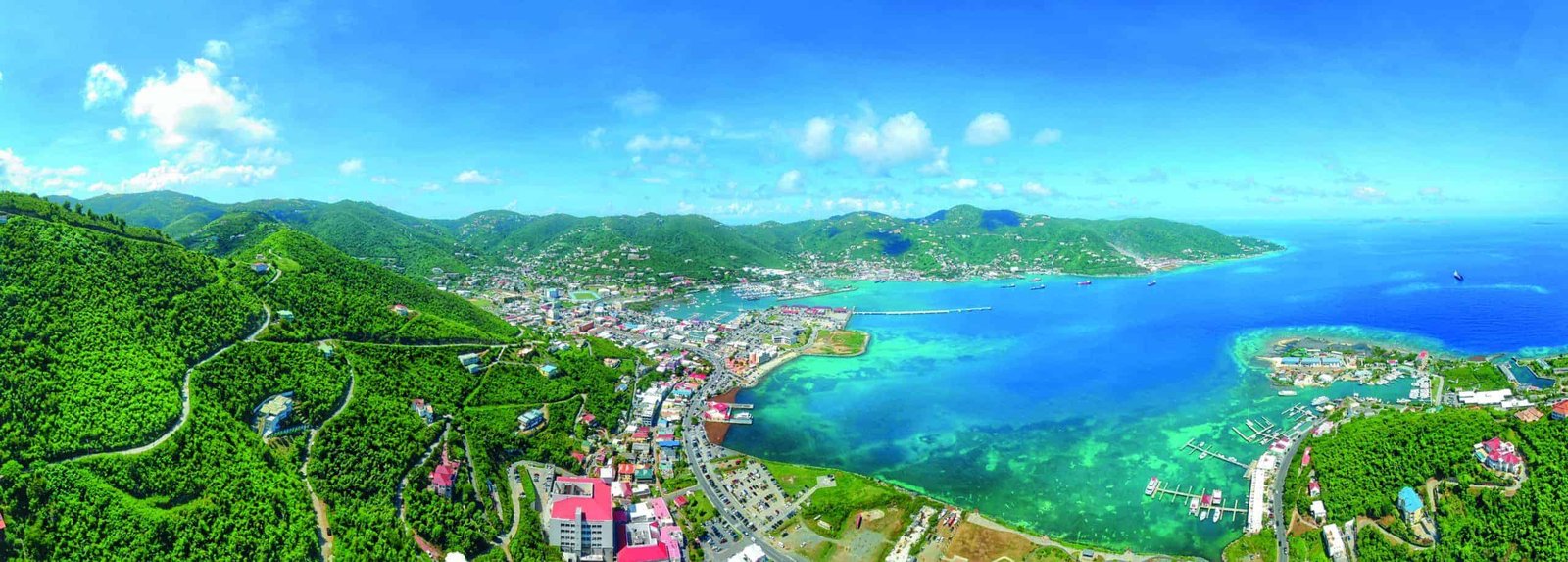 An aerial view of a town overlooking the expansive ocean.