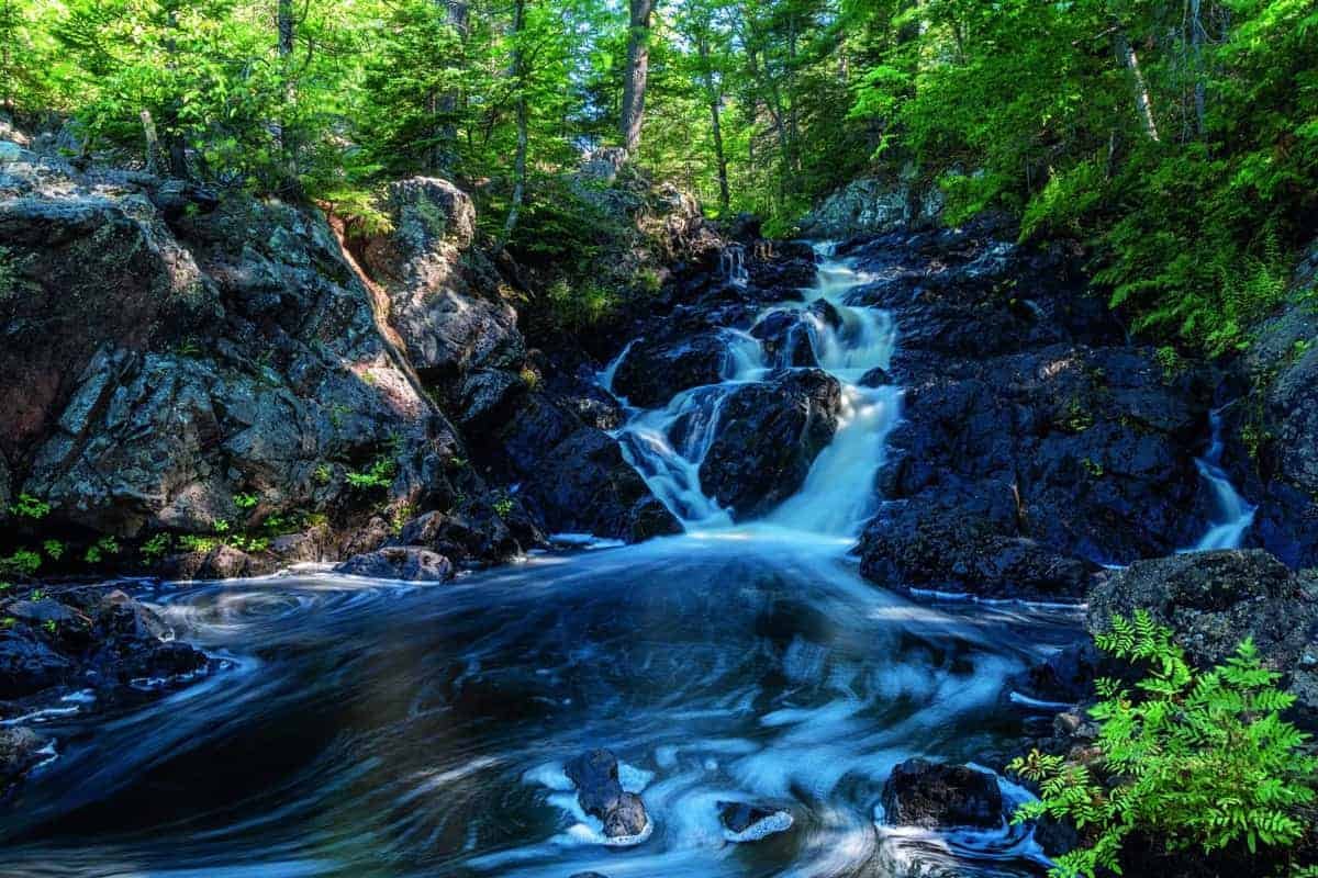 A serene natural choice, this waterfall gracefully cascades within a wooded area.