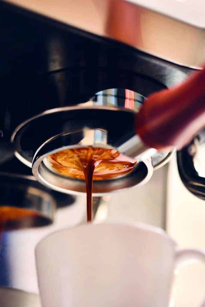 A character pouring coffee into a cup.