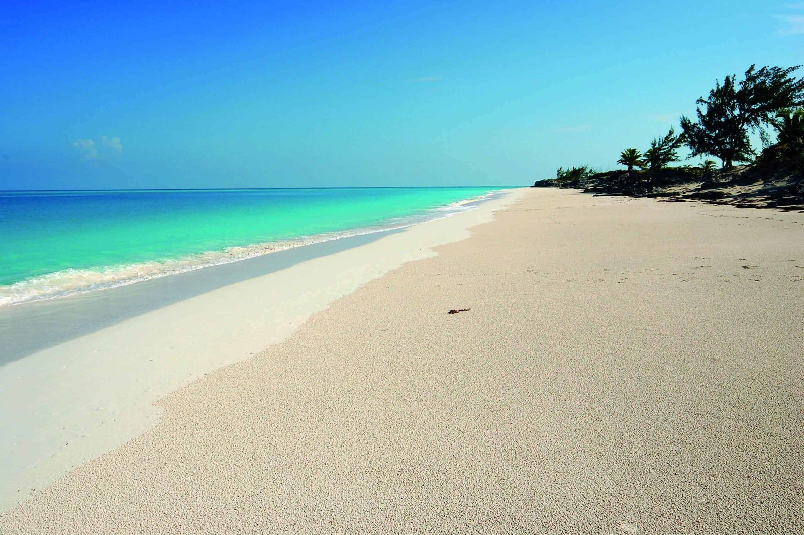 A paradise of white sand on a beach property.