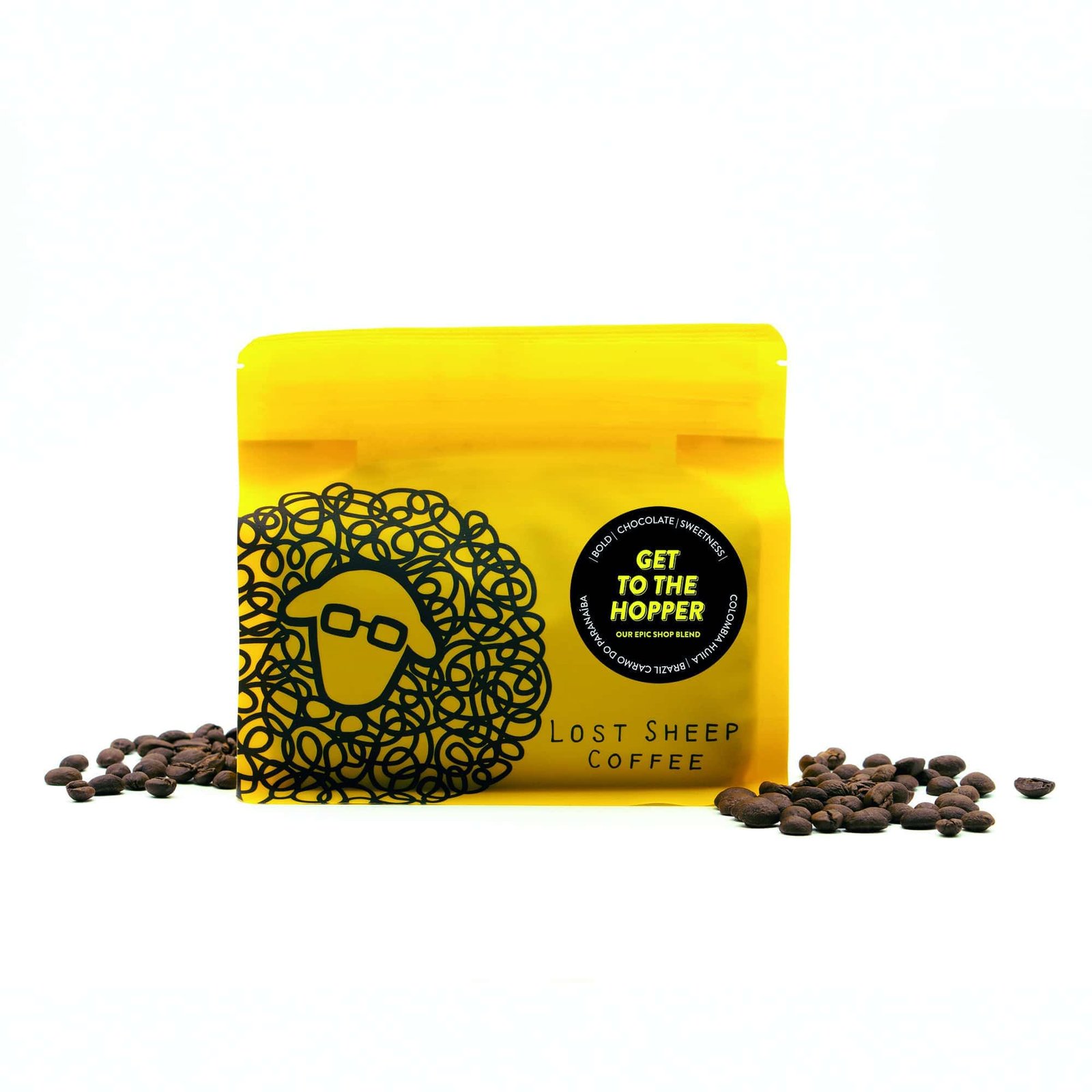 A bag of ground coffee beans on a yellow background.