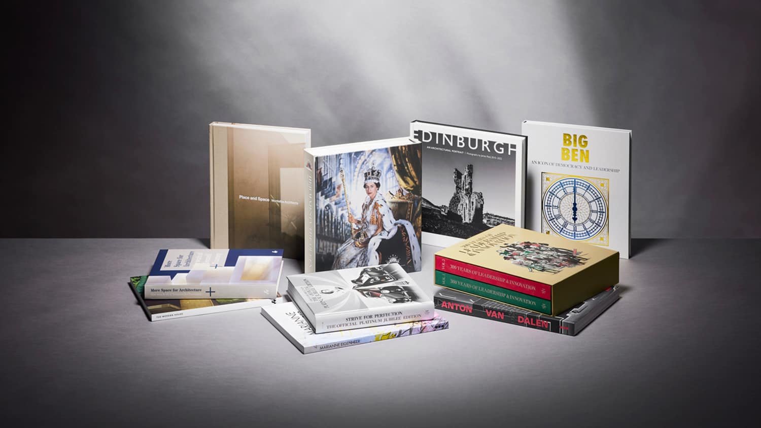 About: A collection of books on a table with a dark background.